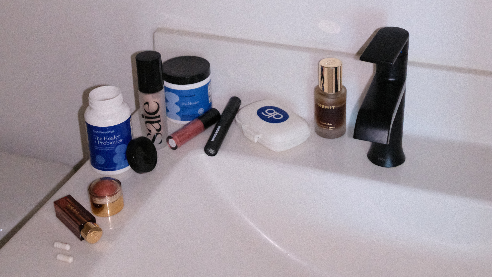 gutpersonal supplements and makeup on sink